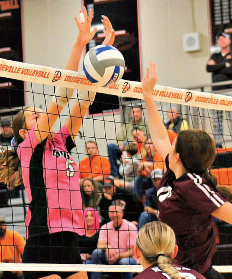 Anna Wellington goes up for a block against Prairie du Chien. Photo by Angie Borne.
