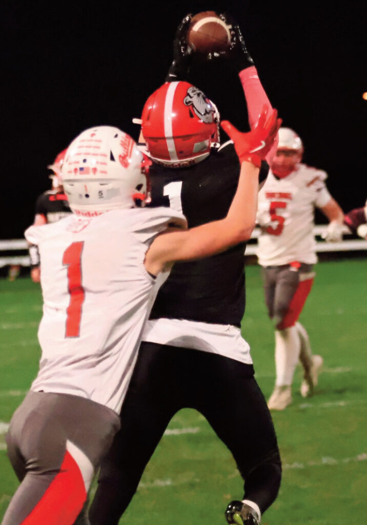 Landon Friesen hauls in one of his interceptions. David Friesen photo.