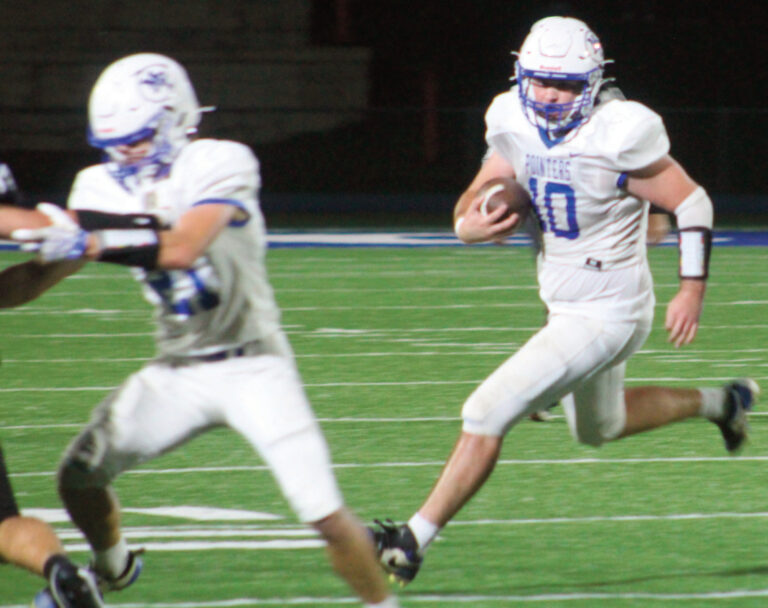 Clayton Yanna (10) turns up the field as Elliot Kite blocks for him.