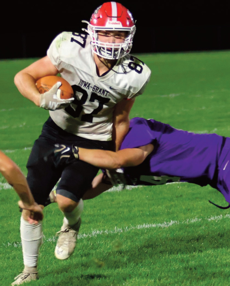 I-G's Ty Cutts tries to shake off a River Ridge defender. David Friesein photo.